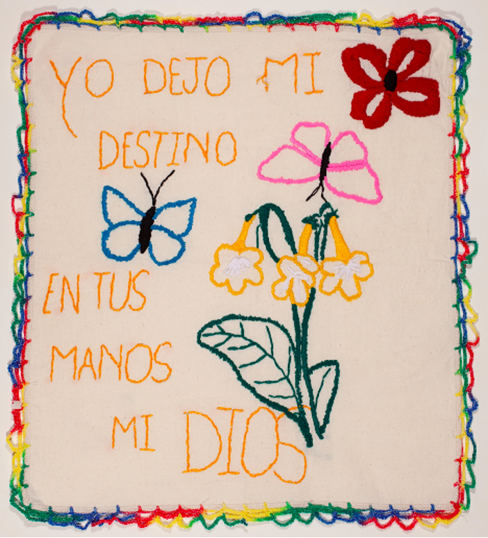 “I leave my destiny in your hands my God,” Original retablo embroidered by Dalianas from Cuba, U.S.- Mexico border, 2020.
