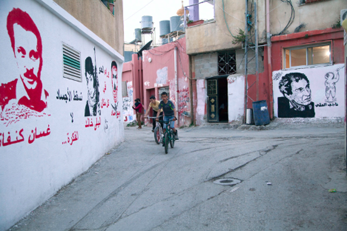 3. The murals, by Mohammad Maily, show three important figures from the PFLP, the writer Ghassan Kanafani, the leader Wadie Haddad, and the (still living) Layla Khalid, known for attempting to hijack two airplanes. On the right is depicted Naji al-Ali, political cartoonist assassinated in 1987. Photograph © 2015 Margaret Olin.